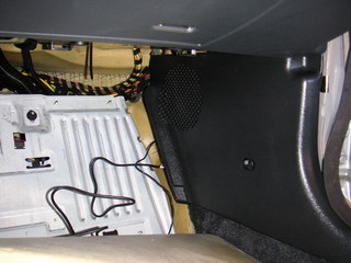 Speaker and microphone cables in passenger side floor space